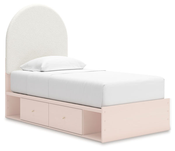 Pretty in pink. This twin upholstered panel bed with storage keeps the spirit of your homeâ€™s modern aesthetic while suiting all your young oneâ€™s needs. Its cozy-cute upholstery and subtle blush finish bring a playful, charming vibe to bedtime. Made fo