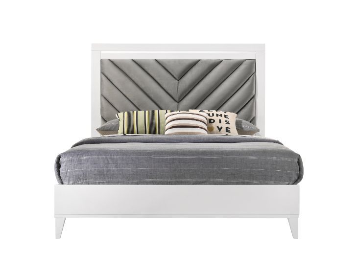 Sleep in style with this modern Chelsie bedroom collection. The sturdy bed is a focal point on its own with its gray channel-tufted headboard and tapered legs. Add depth and reflect light with its silver trim that is featured throughout the bed and case g