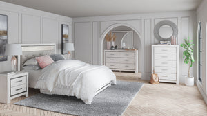 Light finish with subtle pearl effect over replicated cedar grain and authentic touch. Cases and bed are accented with faceted chrome details. Large scaled chrome handle with mosaic details. Side roller glides for smooth operating drawers. Drawer interior