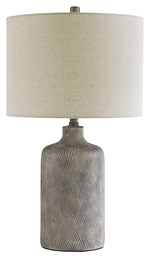 Brighten your bedside or illuminate your living space with this stylish table lamp. Understated ceramic base is finished with a striking antique black effect. Fabric drum shade is a soft touch and harbors light wonderfully.<br><br><b>Additional Dimensions