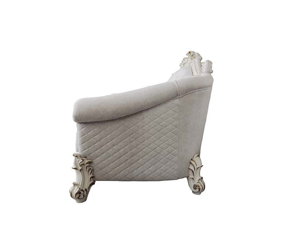  our new interpretation of Vendome II is donned. The Vendome II sofa-'s light gray fabric is grand and classy with crystal like button tufting on the back in a crackled gold p