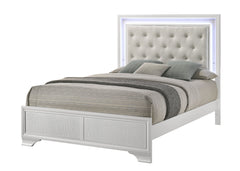 Step into a realm of sophistication and comfort with this stunning bedroom collection. Each piece showcases an exquisite blend of traditional charm and contemporary flair, making a bold statement with its textured surfaces and crisp white finish. The bed,
