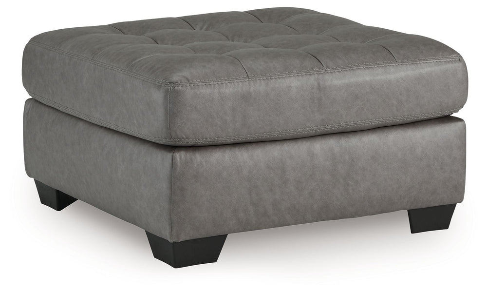 You want your living room to reflect your ultra-cool character. Introducing: this oversized accent ottoman. Its faux leather is a sleek and stylish approach to contemporary aesthetics. For a finishing touch, button tufting adds extra flair.<br><br><b>Addi
