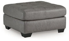You want your living room to reflect your ultra-cool character. Introducing: this oversized accent ottoman. Its faux leather is a sleek and stylish approach to contemporary aesthetics. For a finishing touch, button tufting adds extra flair.<br><br><b>Addi