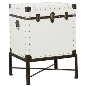 Add vintage-inspired charm to your space with this versatile side table and storage trunk combo. Upholstered in a smooth white leatherette, it features brushed brass nailhead accents for a touch of elegance. The sturdy metal base, finished in a brushed br