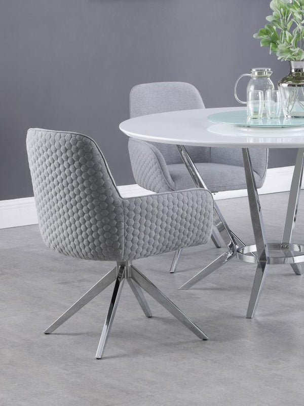  this swivel dining armchair offers both style and function. Upholstered in light grey fabric