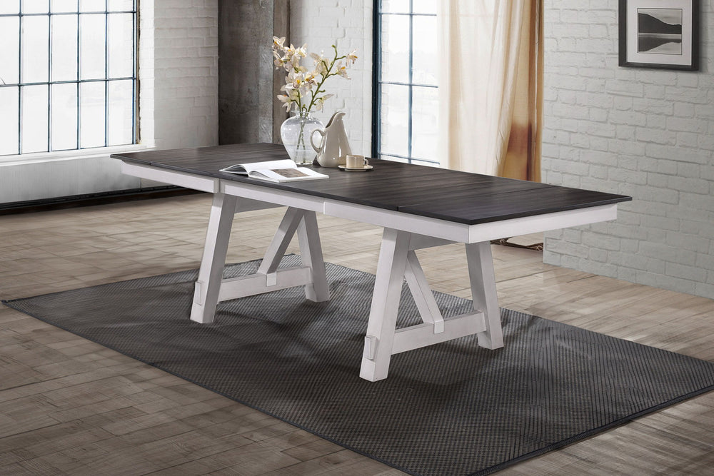 The Maisie Wood Two-Tone Dining Table offers a perfect blend of quality craftsmanship and welcoming rustic charm, ideal for any dining space. This table, crafted from solid rubberwood, manufactured woods, and Mindy wood veneers, is designed for durability