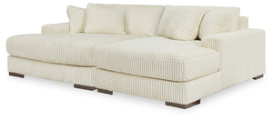 Plush and posh. Showcase your eye for on-trend texture with the statement-making cord upholstery of this double-chaise sectional. Its stunningly soft fabric entices in an ivory hue, complementing contemporary color palettes. Sink into the cushions and pla