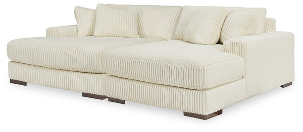 Plush and posh. Showcase your eye for on-trend texture with the statement-making cord upholstery of this double-chaise sectional. Its stunningly soft fabric entices in an ivory hue, complementing contemporary color palettes. Sink into the cushions and pla