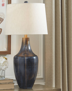  this table lampâ€™s color palette flaunts chic panache wherever itâ€™s placed. Youâ€™ll love how the beautiful glow casts contemporary charm against the distressed metal for a captivating finish.<br><br><b>Additional Dimension