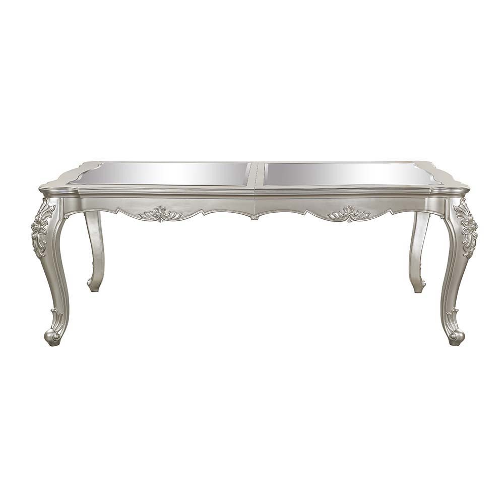 An ode to traditional glamour, the Devayne dining table brings in all the allure and charm that you are seeking for a dining table. The table features an extension leaf that allows for additional dinner guests. The champagne finish enhances the beautiful 