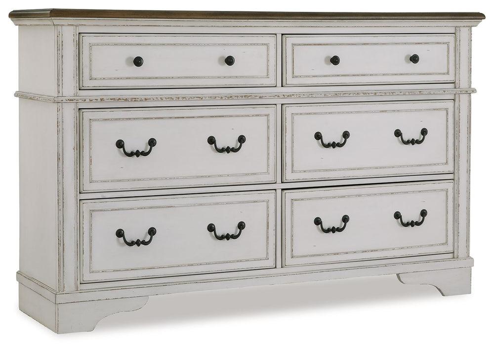 Traditional design. Casual appeal. You can have it all with this dresser. A relaxed two-tone aesthetic merges with ornate profiled drawer fronts and pilasters to give the distinctive piece an allure all its own. Expansive drawers with quality dovetail con