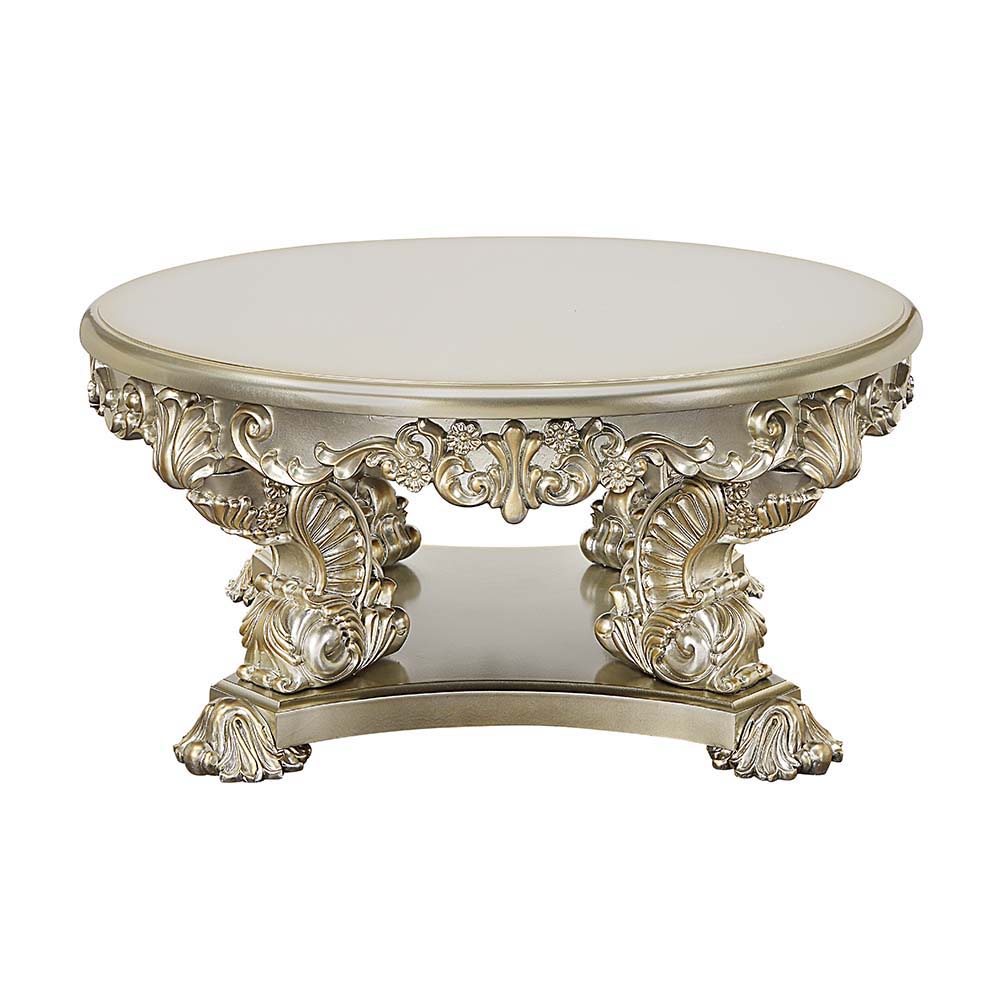 Traditional style that never goes out of fashion, the Sorina coffee table is a great addition to your living room. The silver and gold finishes complement each other flawlessly. This coffee table showcases elaborate carvings on the table base to recreate 
