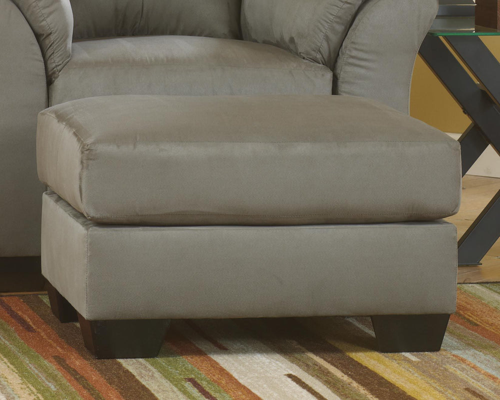 Talk about fine lines and great curves. Thatâ€™s the beauty of this ottomanâ€”made to suit your appreciation for simplicity and love of contemporary style. Tapered feet and ultra-soft upholstery that holds up to everyday living complete this fashion state