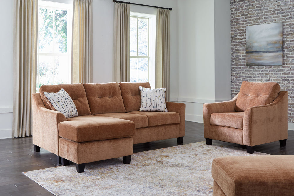 Urban contemporary meets mid century (with a pop of trend-right color) in this set. Supremely soft upholstery, teeming with luster and movement, finesses the piece with just the right touch. Gently flared arms and tufted back cushions let you bask in the 