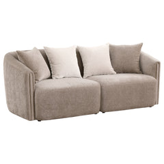 Instill modern appeal with a charming upholstered sofa in soft chenille. Its neutral latte coloration is complemented with tone-on-tone accent pillows, while a slight wavy pattern is the perfect enhancement. A classic shelter silhouette is updated for con