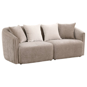 Instill modern appeal with a charming upholstered sofa in soft chenille. Its neutral latte coloration is complemented with tone-on-tone accent pillows, while a slight wavy pattern is the perfect enhancement. A classic shelter silhouette is updated for con
