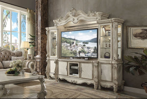 The Versailles the entertainment center was inspired by old European design. This collection features carved scrollwork accent on the bridge-'s crown. The collection pieces are carefully crafted with selected wood and veneers in bone white finish with han