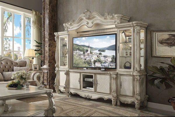The Versailles the entertainment center was inspired by old European design. This collection features carved scrollwork accent on the bridge-'s crown. The collection pieces are carefully crafted with selected wood and veneers in bone white finish with han