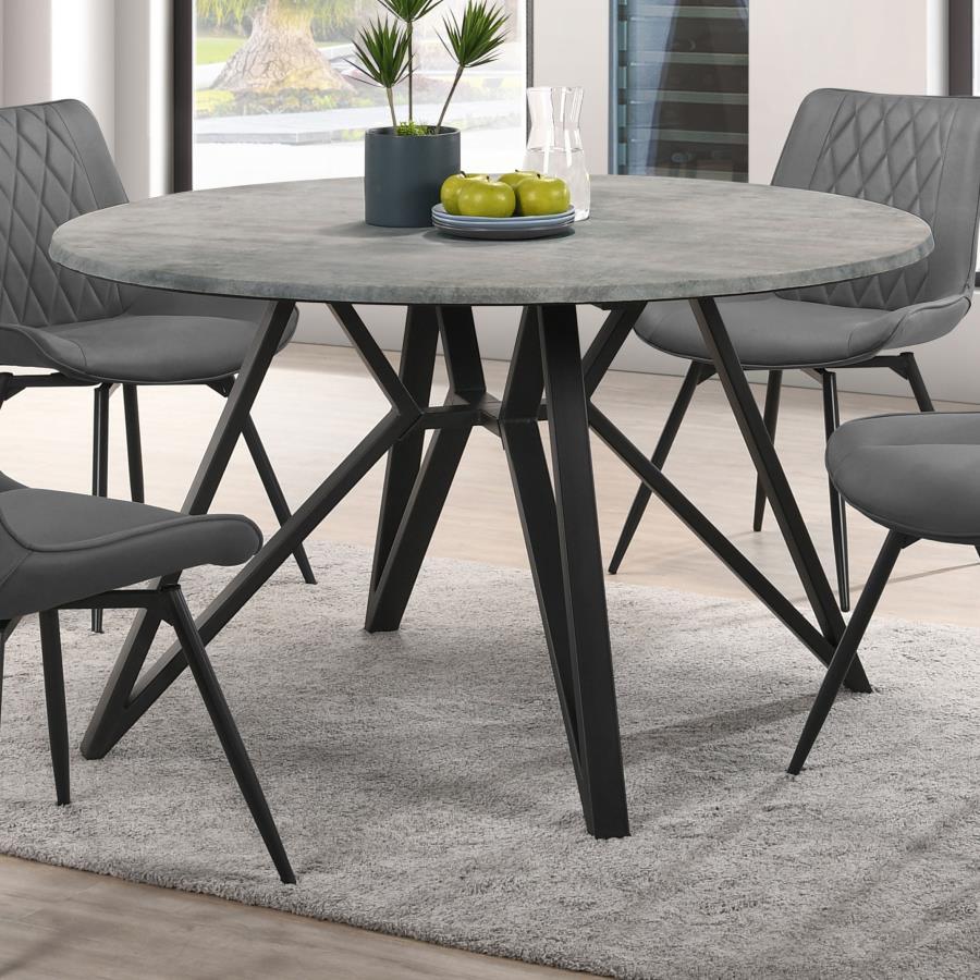 Elevate your modern industrial dining area with this retro-inspired round dining table. Designed with a high pressure laminate table top with a concrete-looking decoration paper, this dining table offers a raw, organic texture to the space. The spacious, 
