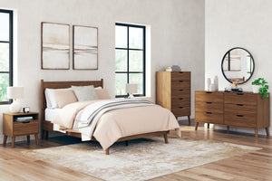 What do you get when you mix a minimalist profile with a warm finish? With sleek simplicity and a rich auburn hue, this bedroom package delivers cool, contemporary style with a nod to mid-century modern design. Talk about completing your restful retreat w