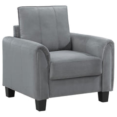 Vertical stitching and rounded arms create a compelling profile for a modern upholstered accent armchair. Perfect for lounging, it boasts velvety soft gray upholstery that-'s on-trend and versatile in your den or living room. A plush seat cushion sits on 