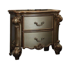 Create an elegant, traditional design in your bedroom with the Gold Patina and bone Vendome nightstand. This hand-crafted piece inspired from the luxurious designs of the past, this two-drawer nightstand features elaborate wood carving details, traditiona