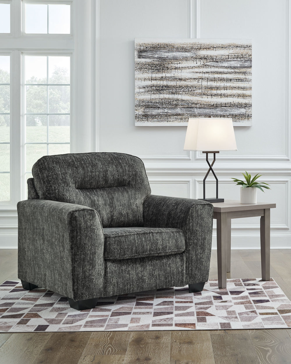 This generously scaled chair speaks to those drawn to fresh, contemporary style with richly neutral appeal. Subtle and sophisticated, the plush upholstery and dark tri-block legs are a natural complement for so many color schemes. Curling up with a good b