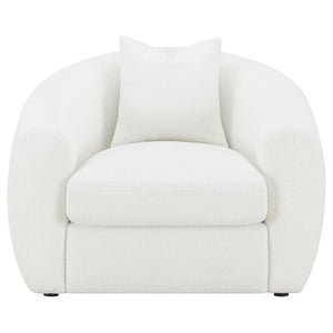  upholstered in a white teddy boucle fabric across its elegantly curved silhouette and sloped armrests. A single accent pillow in a matching boucle rests against the ben