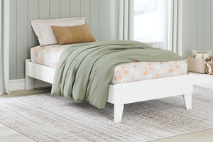  the low-profile bed frame fits right in with your minimalist 