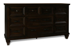 The Sevilla 9-Drawer Dresser in walnut is a masterpiece of timeless craftsmanship and versatile design, making it a stunning addition to any bedroom. Skillfully crafted from solid Acacia wood and Acacia veneers, this dresser features a rich, hand-distress