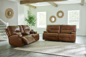 Master statement-making contemporary comfort with this power reclining sofa and loveseat. It displays a striking yet streamlined profile, with auburn-hued leather in the spacious seating area balancing natural beauty and refined design. Adjustable headres