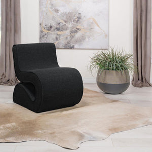  its bouclÃ© fabric not just on-trend but a textural revelation. The chair-'s unique shape is a conversation starter
