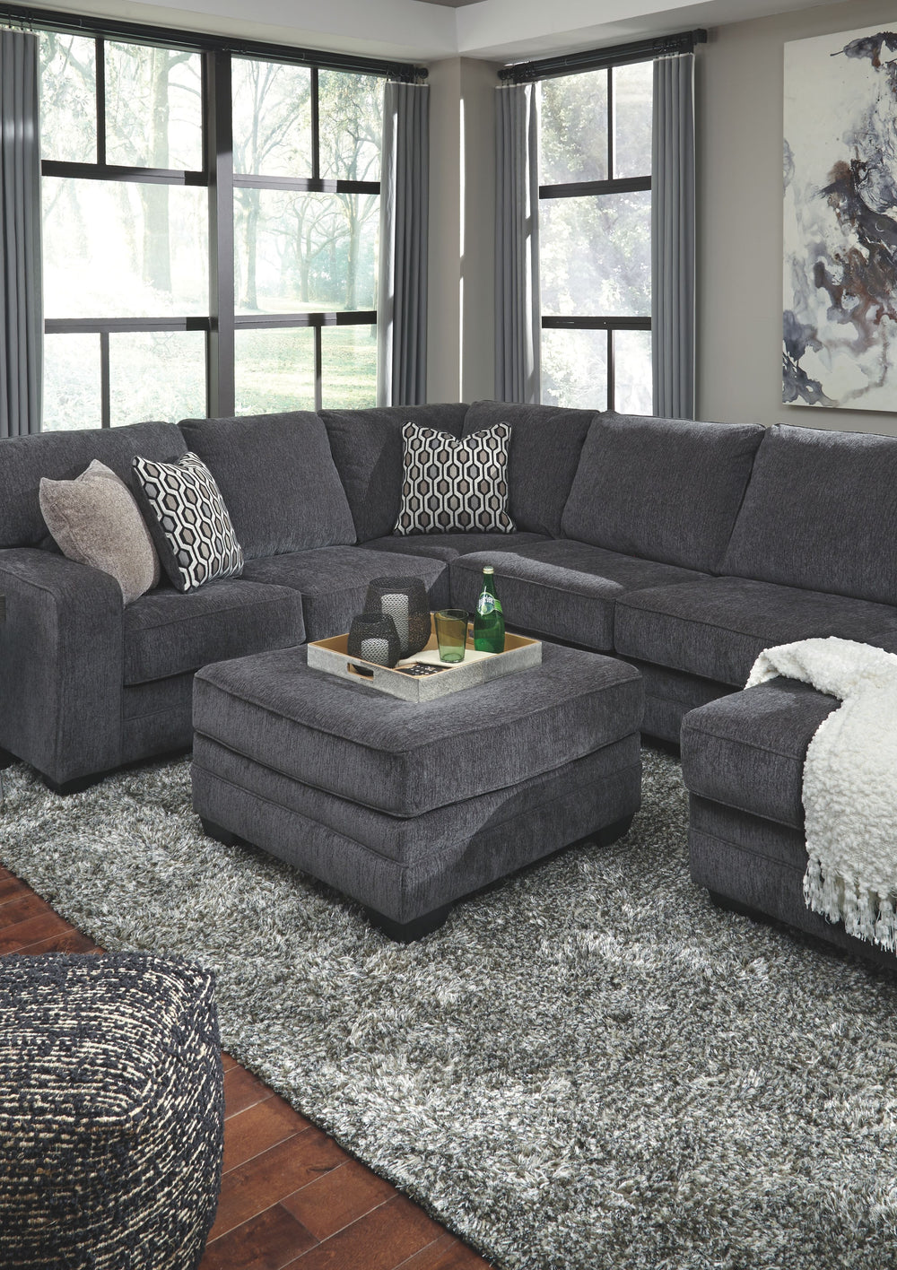 Talk about easy street. This effortlessly chic sectional set puts you at the intersection of cool and comfortable. Ultra-deep seats are custom made for afternoon naps and movie night marathons. So plush to the touch, the sectionalâ€™s slate gray upholster