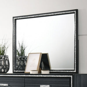 Classic design with touches of modern aspects makes this Haiden Mirror ideal for any bedroom. The rectangular mirror is easy to match your dresser for giving your space an alluring focal point. It also features a wooden frame with a glamorous shimmering s