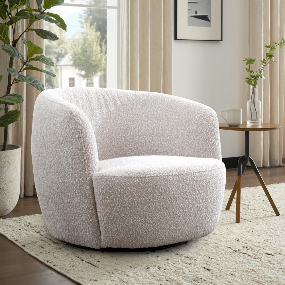 This swiveling accent chair updates your living room with a playful, modern look. It-'s made with a kiln-dried solid pine wood frame with a streamlined barrel silhouette. The design features a curved back with foam padding and a seat bolstered with sinuou