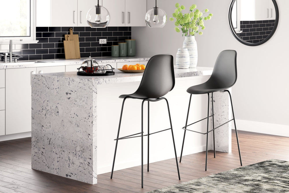 Designed with form and function in mind, this contemporary bar stool sports a slender-yet-sturdy metal frame and a fully contoured bucket seat. With its cool bar height dimensions and classically clean design, this stool transforms a kitchen island or bre