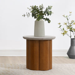 Evelyn collection features a stunning coffee table and end table, each with a round faux concrete finish table top. The robust wooden base adds warmth and durability, perfectly blending modern and rustic elements. This elegant combination brings a sophist
