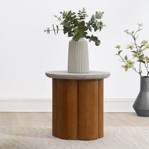 Evelyn collection features a stunning coffee table and end table, each with a round faux concrete finish table top. The robust wooden base adds warmth and durability, perfectly blending modern and rustic elements. This elegant combination brings a sophist