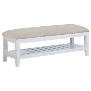 This sleek and versatile bench brings a touch of timeless elegance to any room. Its beige upholstered, foam-padded seat offers exceptional comfort while the sturdy wooden frame, finished in white, ensures long-lasting durability. A slatted shelf beneath t