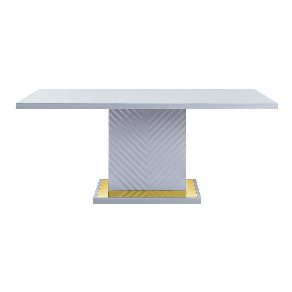 The sleek clean-lined table Gaines dining table offers subtle a hint of glam, the base offers a touch of gold to enhance the textured vertical lined pedestal. The gray high gloss finish reflects light and makes any dining space appear larger and grander. 