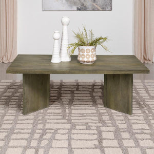  it dances upon the surface of a coffee table that exudes a primal elegance. Made from solid mango wood