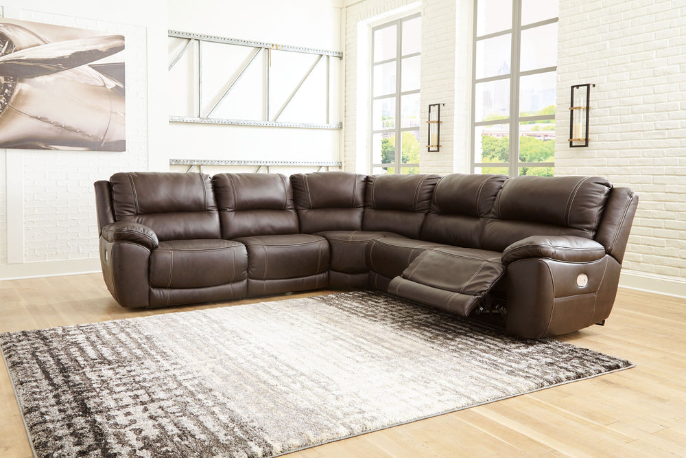 Load up on comfort in a cool, clean-lined and contemporary way with this power reclining sectional in chocolate brown. Rest assured, the expertly matched leather and faux leather upholstery is enriched with a pebble grain effect for authentic appeal and e