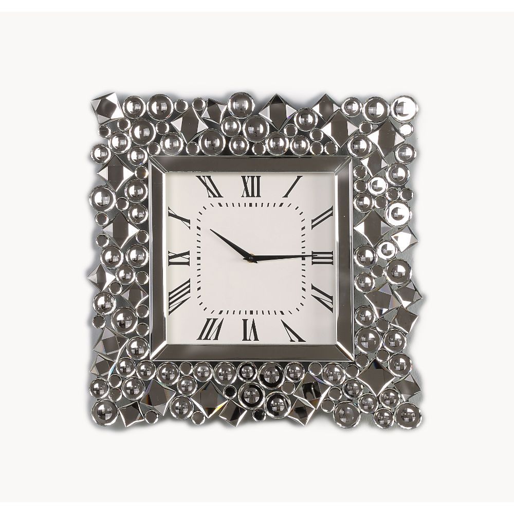 An even mix of function and fashion, this eye-catching Kachina wall clock keeps your eye on the hour with chic style. The faux gem inlay adorned frame with mirrored panels add a dash of glamour. Lean into this piece-'s traditional influence by adding it t