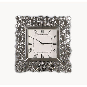 An even mix of function and fashion, this eye-catching Kachina wall clock keeps your eye on the hour with chic style. The faux gem inlay adorned frame with mirrored panels add a dash of glamour. Lean into this piece-'s traditional influence by adding it t
