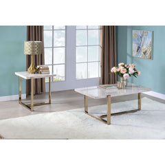 Expertly painted champagne gold -"T-" shaped base, and faux marble table tops the Feit occasional tables offer a delicate and gorgeous structure. These highly recommended tables will be a prominent furniture piece in any living room with its bright color 