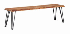 The perfect marriage of rustic charm and industrial design, this rectangular dining bench makes a modern statement. Designed with natural acacia, the bench top features an exposed wood grain with slight distressing. Contrasting against this warmth is the 
