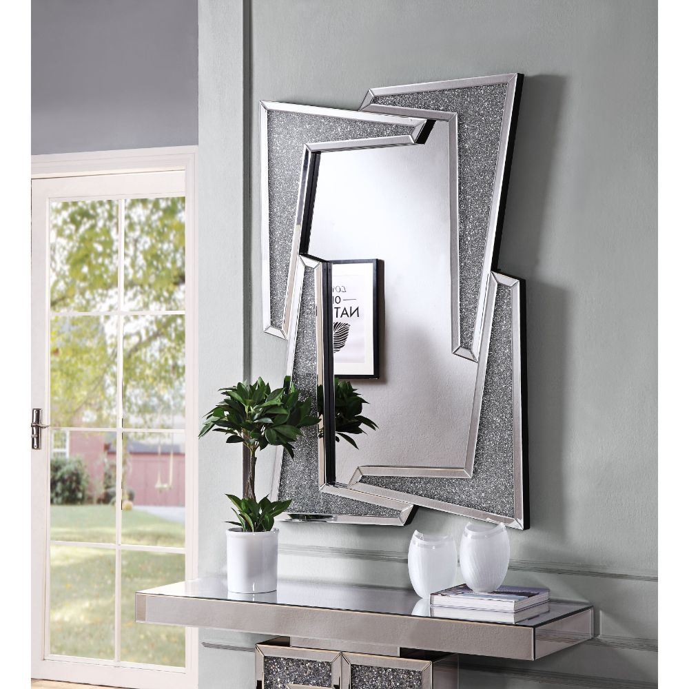 This alluring Noralie accent mirror lends a touch of glimmering glam to your decor. The dazzling design showcases a striking clean-cut rectangular silhouette and mirrored frame with faux diamond inlay. Hang this piece vertically at the end of your formal 