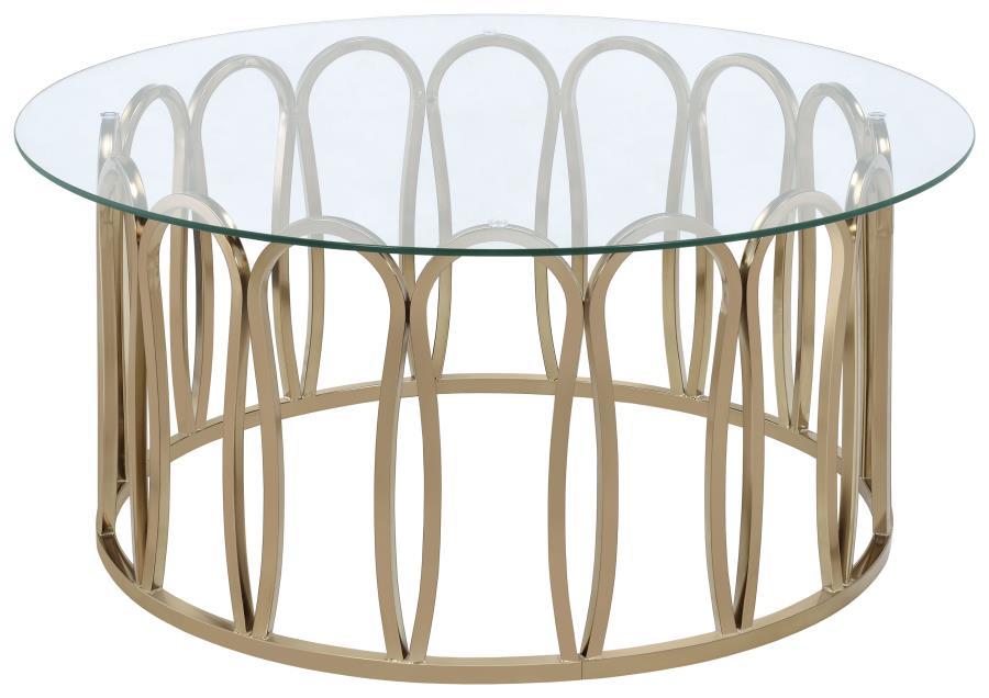 This round coffee table features a clear tempered glass top supported by a durable metal frame. The base is finished in a striking electroplated chocolate chrome, providing a deeper, rich brass tone. With its sleek design, this coffee table is an ideal ad