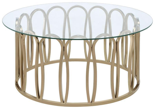 This round coffee table features a clear tempered glass top supported by a durable metal frame. The base is finished in a striking electroplated chocolate chrome, providing a deeper, rich brass tone. With its sleek design, this coffee table is an ideal ad
